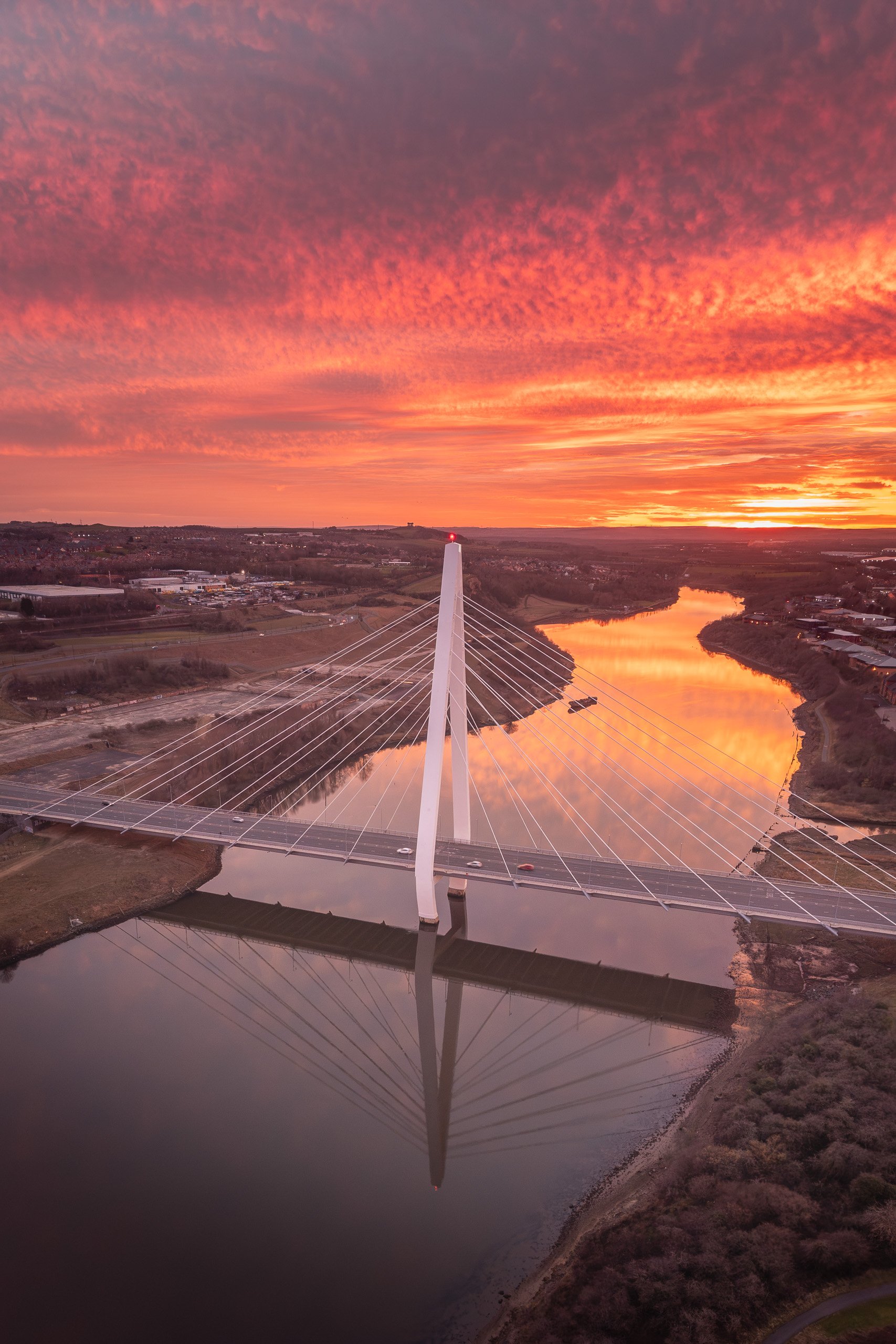 Aerial view of the Northern Spire Bridge at sunset