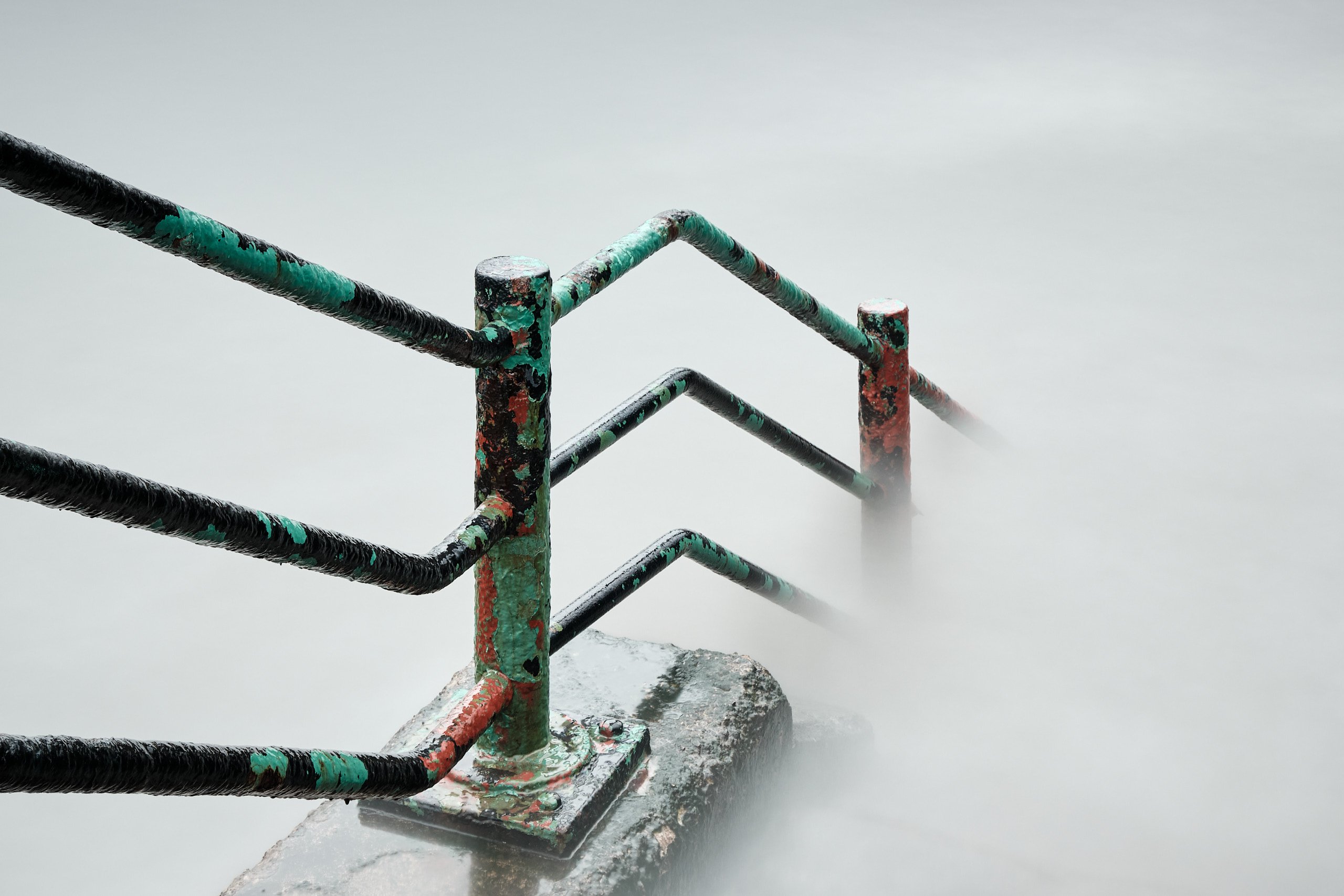 Seafront railings at Roker at high tide