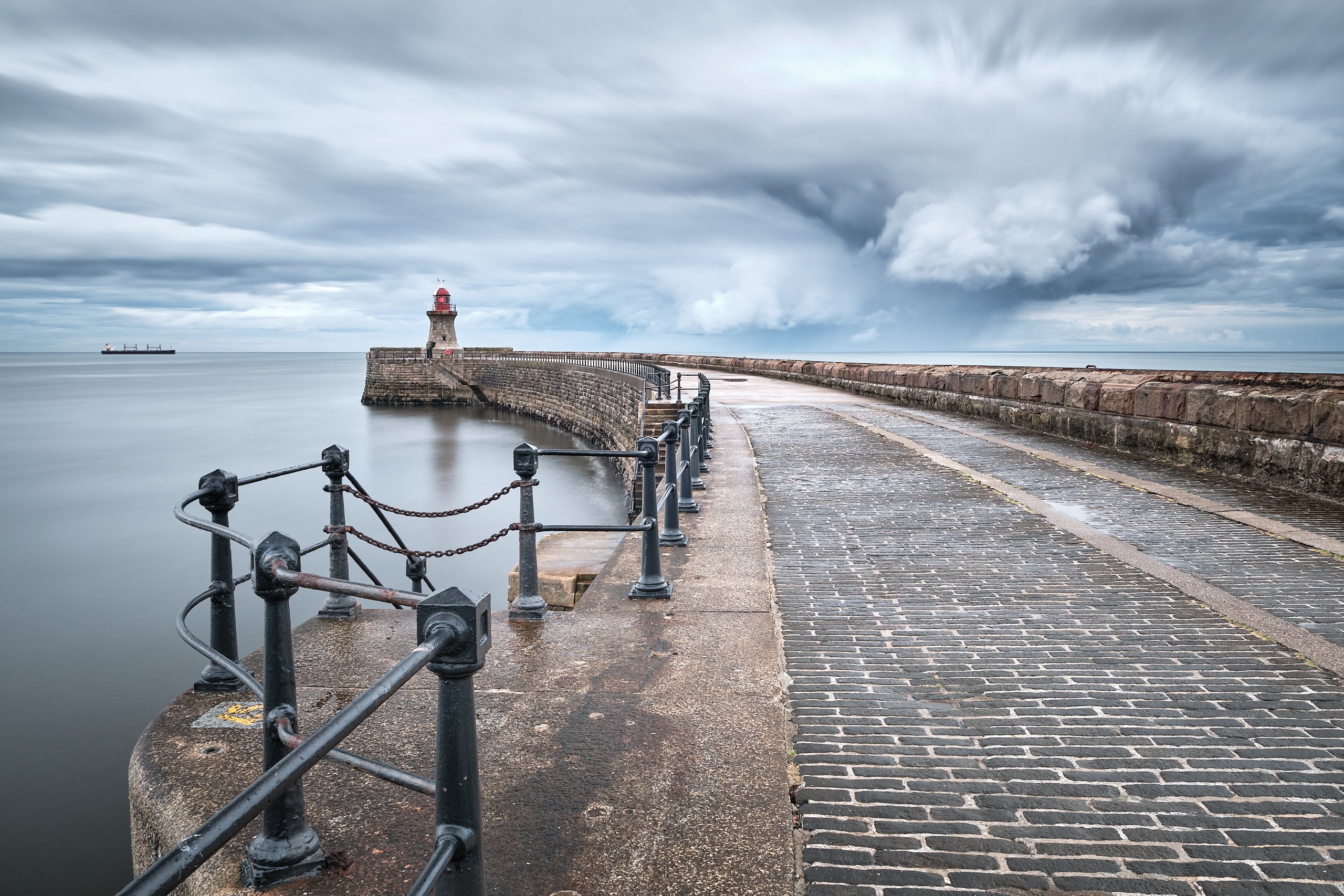 South Shields pier and lighthouse under dramatic storm clouds